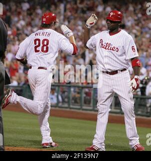 Philadelphia Phillies' Jayson Werth, right, is congratulated by teammate  Pat Burrell after Werth scored during the first inning of a baseball game  against the San Diego Padres Saturday, Aug. 16, 2008, in