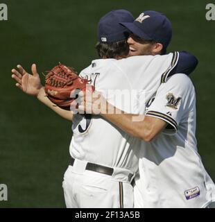 Milwaukee Brewers J.J. Hardy gets a fist with thumbs up from first base  coach Eddie Sedar after hitting a two run RBI single off of St. Louis  Cardinals pitcher Todd Wellemeyer in