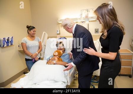 President Donald Trump and First Lady Melania Trump visit with a patient Wednesday October 4 2017 at the University Medical Center of Southern Nevada who was injured in the mass shooting Sunday October 1 2017 Stock Photo