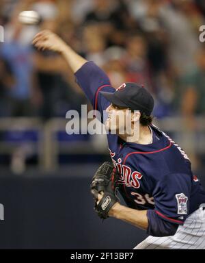 Minnesota Twins catcher Joe Mauer, left, and relief pitcher Joe Nathan  celebrate their 7-4 win over the Chicago Cubs after an interleague baseball  game, Friday, June 12, 2009 at Wrigley Field in