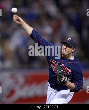 Minnesota Twins catcher Joe Mauer, left, and relief pitcher Joe Nathan  celebrate their 7-4 win over the Chicago Cubs after an interleague baseball  game, Friday, June 12, 2009 at Wrigley Field in