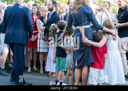 First Lady Melania Trump poses for a photo with guests attending the Congressional Picnic Friday June 21 2019 on the South Lawn of the White House. Stock Photo
