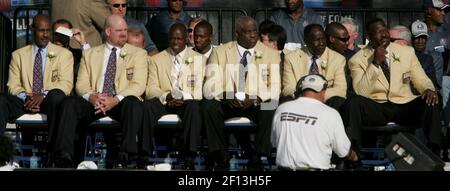 Edward DeBartolo, Jr., former owner of the 49ers, helps Fred Dean, of the  San Diego Chargers and the San Francisco 49ers, unveil his bust at the Pro  Football Hall of Fame 2008