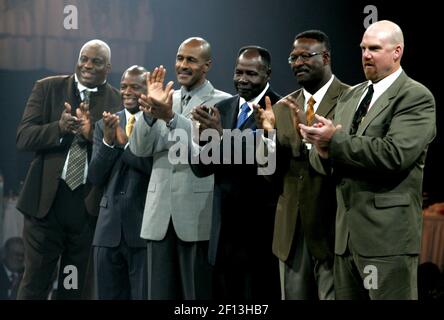 Edward DeBartolo, Jr., former owner of the 49ers, helps Fred Dean, of the  San Diego Chargers and the San Francisco 49ers, unveil his bust at the Pro  Football Hall of Fame 2008