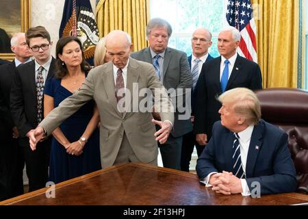 President Donald Trump and Vice President Mike Pence welcome Apollo 11 astronauts Buzz Aldrin and Michael Collins along with the family members of astronaut Neil Armstrong Friday July 19 2019 to the Oval Office of the White House to commemorate the 50th anniversary of the Apollo 11 Moon Landing. (Official White House Photo by Andrea Hanks) Stock Photo