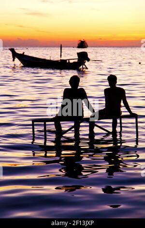 Sunrise people boat  and water in thailand kho Stock Photo