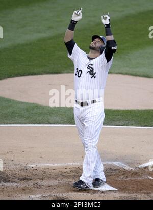 Chicago White Sox's Nick Swisher (R) hugs Ken Griffey Jr. after