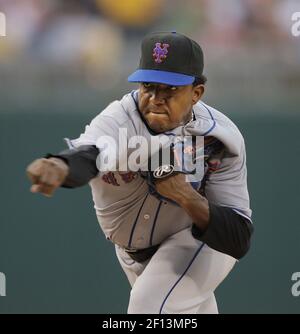 New York Mets pitcher Pedro Martinez puts his hand to his face after he was  taken out of the baseball game in the sixth inning against the Los Angeles  Dodgers in Los