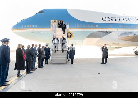 President Donald Trump joined by Dana White the president of the Ultimate Fighting Championship UFC is greeted by state officials and military personnel as he disembarks Air Force One Thursday Feb. 20