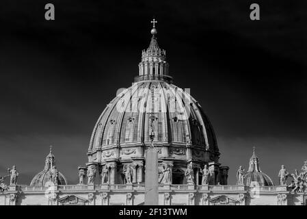 The dome of St. Peter's Basilica in Vatican City, the largest church in the world (black & white) Stock Photo