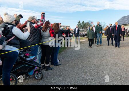 President Donald Trump greets supporters during his visit to Treworgy Family Orchards Sunday Oct. 25 2020 in Levant Maine. Stock Photo