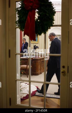 Dec. 2 2010; President Barack Obama makes Congressional phone calls with Phil Schiliro pacing back and forth Stock Photo