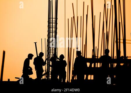 construction worker silhouette on the work place Stock Photo