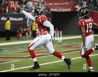 Atlanta Falcons' Alge Crumpler (83) scores on a 18 yard touchdown pass from  quarterback Michael Vick as the Los Angeles Rams' Adam Archuleta (31)  defends in the first quarter of their NFC