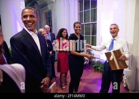 President Barack Obama and First Lady Michelle Obama pay tribute to outgoing Chief of Staff Rahm Emanuel at a reception on the Truman Balcony of the White House with senior staff, Oct. 1, 2010 Stock Photo
