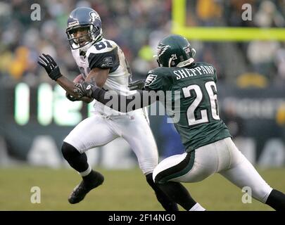 Philadelphia Eagles cornerback Lito Sheppard shows fans the football he  intercepted, intended for Dallas Cowboys receiver Terrell Owens, early in  the fourth quarter of an NFL football game Sunday, Oct. 8, 2006,