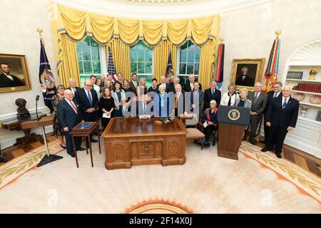 President Donald Trump joined by Edwin Meese III and his family poses for photos prior to awarding the Presidential Medal of Freedom the nation's highest civilian honor to former Reagan administration Attorney General Edwin Meese III Tuesday Oct. 8 2019 in the Oval Office of the White House. Stock Photo