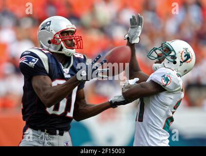 New England Patriots receiver Randy Moss checks the clock during second  half action against the Miami Dolphins at Landshark stadium in Miami on  December 6, 2009. The Dolphins defeated the Patriots 22-21.