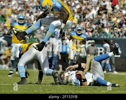 Chicago Bears quarterback Justin Fields spins out off the grasp of Detroit  Lions defensive end John Cominsky during an NFL football game Sunday, Nov.  13, 2022, in Chicago. (AP Photo/Charles Rex Arbogast