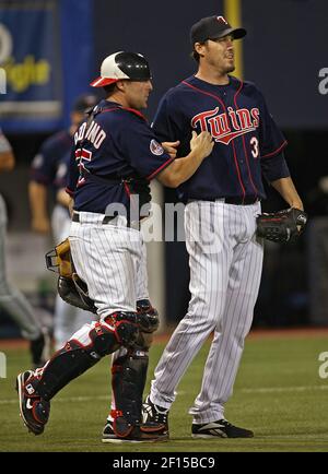 Minnesota Twins catcher Joe Mauer, left, and relief pitcher Joe Nathan  celebrate their 7-4 win over the Chicago Cubs after an interleague baseball  game, Friday, June 12, 2009 at Wrigley Field in