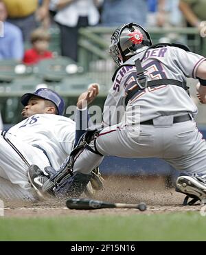 Milwaukee Brewers' Prince Fielder, bottom, beats the throw to Pittsburgh  Pirates first baseman Joe Randa to avoid being doubled off first on a line  drive to third by Kevin Mench in the