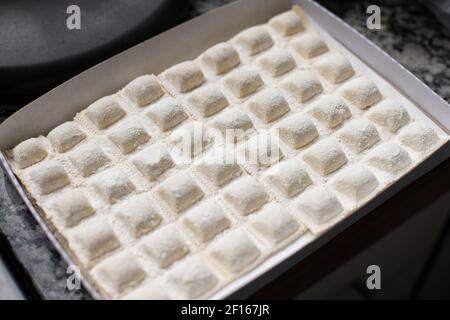 Raw italian ravioli in box ready to be cooked Stock Photo