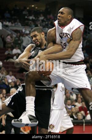 Philadelphia 76ers' Steven Hunter, right, blocks the shot of Los Angeles  Clippers' Cuttino Mobley (5) as teammate Elton Brand, left, looks on during  the first half of a NBA basketball game in