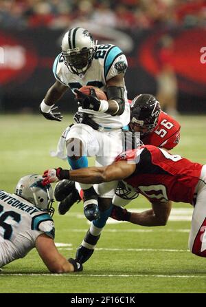 FILE ** Tampa Bay Buccaneers' Carnell Williams (24) outruns Atlanta Falcons  linebacker Keith Brooking (56) as he scores a touchdown to tie the game in  the final minutes in Atlanta, Sunday