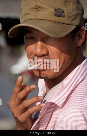 Vietnam Vietnamese Man Smoking A Cigarette Mekong Delta Stock Photo - Alamy
