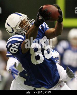 Indianapolis Colts wide receiver Marvin Harrison (88) carries his son in  celebration after the Super Bowl XLI at Dolphin Stadium in Miami on  February 4, 2007. The Colts defeated the Bears 29-17. (