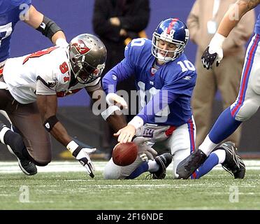 Tampa Bay Buccaneers' Simeon Rice (97) removes his gloves with 30