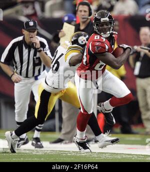 Cleveland Browns quarterback Charlie Frye (9) gets sacked for a loss of 12  yards in the the third quarter by Pittsburgh Steelers cornerback Deshea  Townsend December 24, 2005 at Cleveland Browns Stadium.