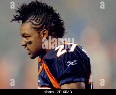 Denver Broncos cornerback Darrent Williams (R) shows off his newly