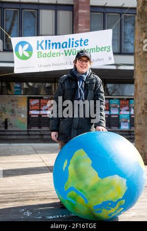 Freiburg, Germany. 07th Mar, 2021. State parliament election candidate Alexander Grevel stands at a campaign stand of the Klimaliste on the square of the Old Synagogue. After the previous party congress had to be cancelled due to technical problems, the election programme is now to be officially adopted at another online party congress. Credit: Philipp von Ditfurth/dpa/Alamy Live News Stock Photo