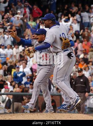 Los Angeles Dodgers', from left, Rafael Furcal, Takashi Saito, of Japan,  J.D. Drew, Wilson Betemit and Julio Lugo celebrate their 4-2 victory  against the Colorado Rockies in a baseball game in Los