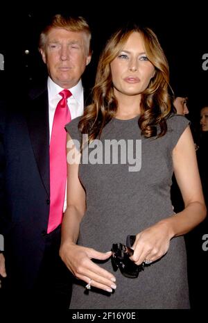 L R Donald Trump and Melania Trump front row at Oscar de la Renta