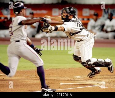 The Washington Nationals' Alfonso Soriano scores in front of Chicago Cubs'  pitcher Mark Prior after a wild pitch in the first inning of their game at  RFK Stadium in Washington, DC, on