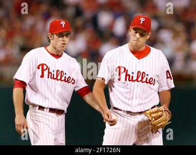 Philadelphia Phillies' Chase Utley tries to flip a ball to Jimmy