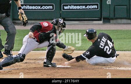 Houston Astros catcher Brad Ausmus returns to the dugout to go to bat  against the Washington Nationals at Osceola County Stadium in Kissimmee,  Florida, on March 7, 2007. (UPI Photo/Ed Wolfstein Stock