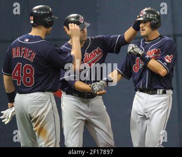 The Cleveland Indians Ben Broussard (C) hit a three run home run to deep  left center in the third inning scoring Victor Martinez (R) and Ronnie  Belliard (L) off of the Baltimore