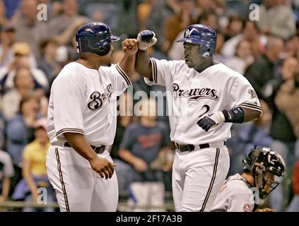 Milwaukee Brewers' J.J. Hardy, right, is congratulated by Prince Fielder  after hitting a two-run home run during the fifth inning of a baseball game  against the Pittsburgh Pirates Friday, July 4, 2008