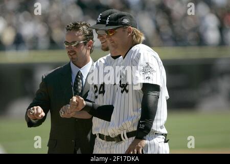 Former Chicago White Sox player Harold Baines throws out the ceremonial  first pitch before an opening day baseball game between the Seattle  Mariners and the Chicago White Sox in Chicago, Tuesday, April