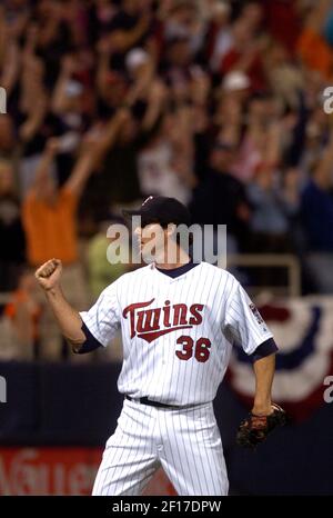 Minnesota Twins catcher Joe Mauer, left, and relief pitcher Joe Nathan  celebrate their 7-4 win over the Chicago Cubs after an interleague baseball  game, Friday, June 12, 2009 at Wrigley Field in