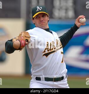 Barry Zito of the Oakland Athletics pitches during a 2002 MLB season game  against the Los Angeles Angels at Angel Stadium, in Anaheim, California.  (Larry Goren/Four Seam Images via AP Images Stock