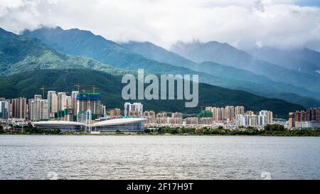 Dali China , 7 October 2020 : Erhai lake view with Dali modern city and Cangshan mountain view in the distance in Yunnan China Stock Photo