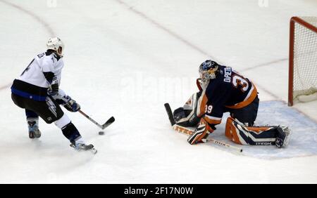 Rick DiPietro #39 of the New York Islanders, while wearing…