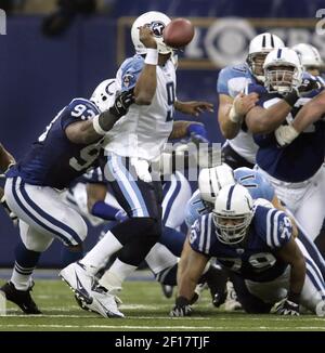 Tennessee Titans quarterback Steve McNair, top center, powers his way  through Chicago Bears' Mike Brown (30) and Shawn Wooden (22) to make a  one-yard quarterback keeper touchdown in the first quarter Friday