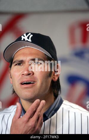 Johnny Damon, with his new, short hair cut, gestures to fans before  attending a press conference where he is introduced as the newest member of  the New York Yankees team at Yankee