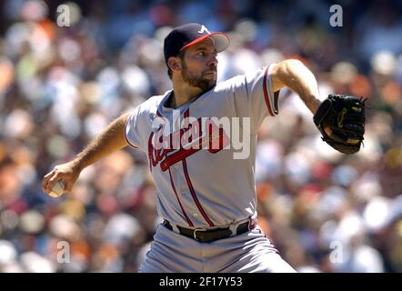 Atlanta Braves starting pitcher John Smoltz (L), who won his 200th