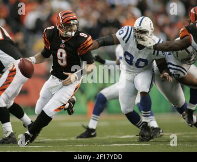 Tampa Bay Buccaneers fullback Mike Alstott (40) is tripped up by  Indianapolis Colts' Raheem Brock (79), while Colts' Montae Reagor (90)  chases during the first quarter Monday night Oct. 6, 2003 in